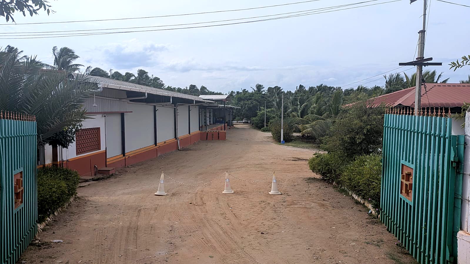 Entrance and approach road to the Vilva Fruits cold storage near Coimbatore